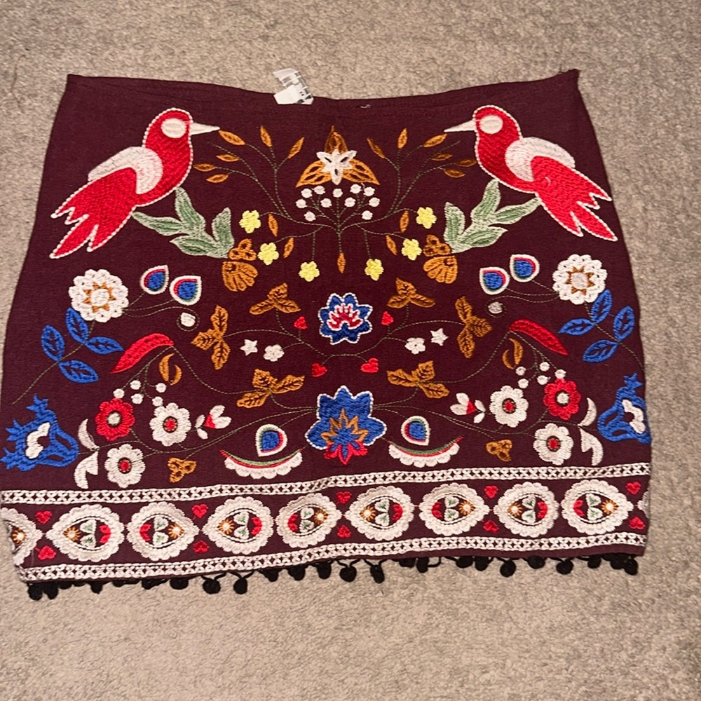 Festive knit mini skirt. Fun and intricate details.